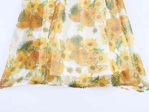 Detail of sunflower print on sheer organza fabric with soft inner lining layer