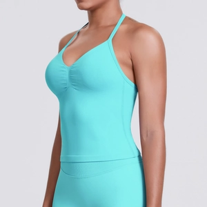 Detail view of the mint green racerback sports bra featuring ribbed fabric and V-neckline