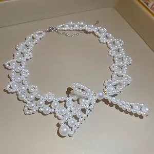 Elegant stainless steel bow pearl necklace with a vintage droplet pearl pendant design
