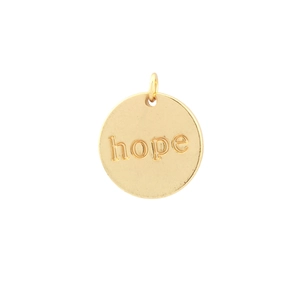Detailed view of a gold circular metal pendant with a small hoop and engraved hope text