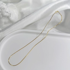 Minimalist S925 silver gold-plated snake bone chain necklace with a classic spring clasp
