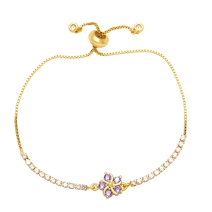 Adjustable gold flower bracelet with purple and white cubic zirconia crystals