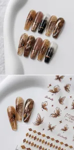 Detailed amber butterfly nail stickers with gold embossed lines and rhombic patterns