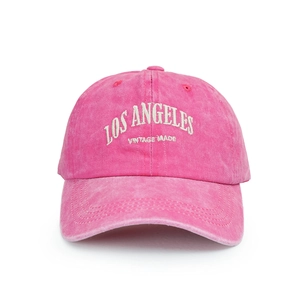 Detail of rose pink washed cotton baseball cap with white LOS ANGELES embroidery
