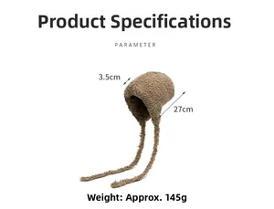 Detail view of coffee brown plush earflap hat with long ties and warm winter texture