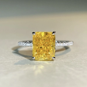 Luxurious S925 silver ring with a large radiant cut yellow zircon and pavé diamonds