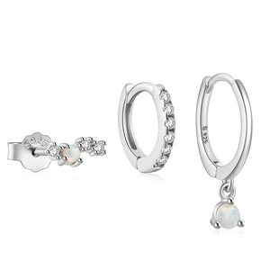 Macro shot of S925 sterling silver evil eye earring set with opal and tiny diamonds