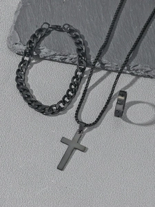 Detailed set of black metal jewelry featuring a cross pendant, cuban chain, and hollow ring