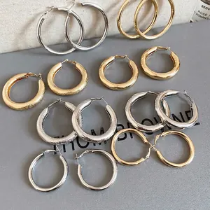 Chic gold and silver polished hoop earrings set with textured finish for women