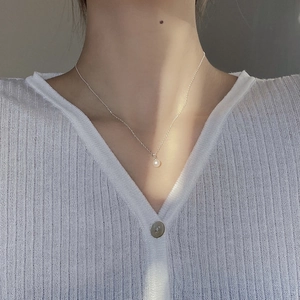 Elegant natural freshwater pearl necklace on S925 sterling silver chain shown on model