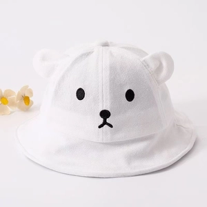 Close-up of white baby bucket hat with cute bear ear 3D decorations and embroidery