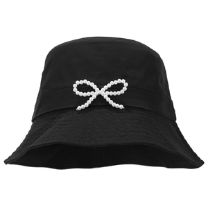 Women's black bucket hat with pearl bow ornament and quilted texture on white background