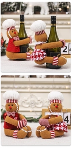 Detail of gingerbread man wine bottle covers with plush fabric and festive red outfits
