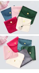 Detailed close-up of colorful velvet jewelry pouches with premium metal snap buttons