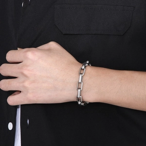 Minimalist silver men's titanium steel chain bracelet shown on wrist with geometric edges