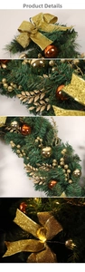 Detailed view of green Christmas garland with golden bows, glitter balls and warm LED lights
