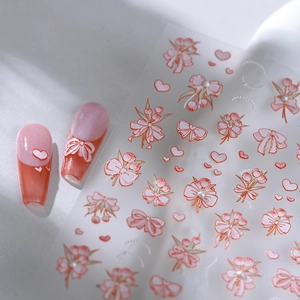 5D butterfly nail stickers with pink bows and pearls shown on nails and sheet