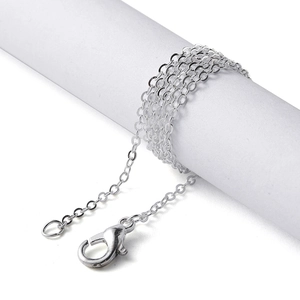 Macro shot of silver O-chain necklace links with secure lobster clasp for jewelry making