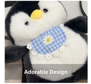 Detail of plush penguin backpack with blue checkered bib and embroidered daisy flower