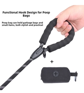 Close-up of reflective dog leash with foam handle and detachable waste bag dispenser