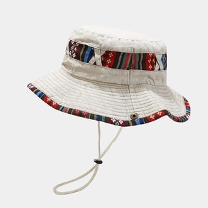 Detail of canvas bucket hat with ethnic woven band, adjustable wind rope and air vents