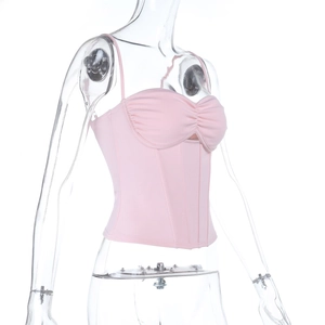 Side view of pink bustier top with gathered bust and structured corset lines on mannequin