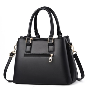 Classic black tote bag for women with dual top handles and adjustable shoulder strap