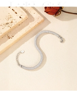 Detail of S925 sterling silver woven mesh bracelet with 925 heart charm and lobster clasp