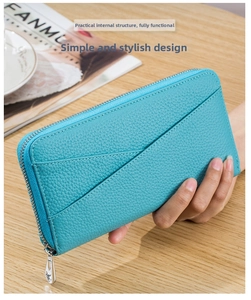 Detail of blue pebble grain leather wallet with multiple card slots and silver zipper