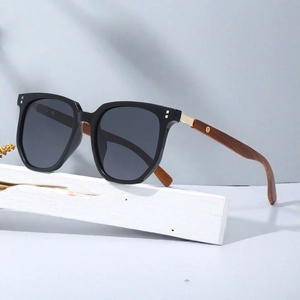 Detail shot of vintage polygonal sunglasses featuring premium wood grain temples