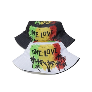 Detail of ONE LOVE print with palm trees on black and white cotton bucket hats