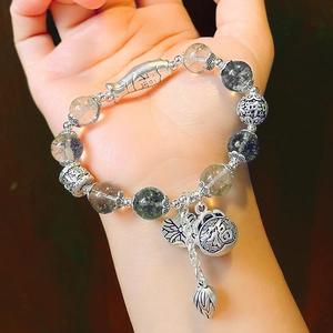 Detail of Green Ghost Crystal bracelet with S925 silver pendants and Fu character