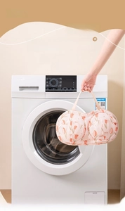 Detailed view of tulip print mesh laundry bag for bras with protective handle