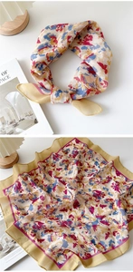 Detail of artistic floral print cotton linen square scarf with red rolled hem edges