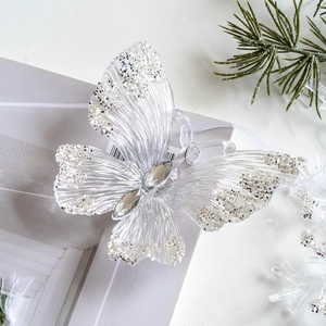 Clear acrylic butterfly Christmas tree ornament with silver sequins and central rhinestone