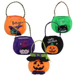 Five assorted Halloween fabric candy bags with striped handles featuring spooky characters