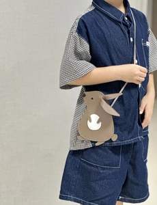 Detailed view of kids cute brown rabbit crossbody bag with litchi texture material