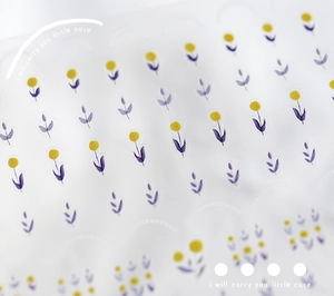 Macro shot of 5D floral nail stickers featuring yellow dots and purple leaves patterns