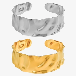 Adjustable C-shaped stainless steel bangles with 18k gold finish and hammered texture