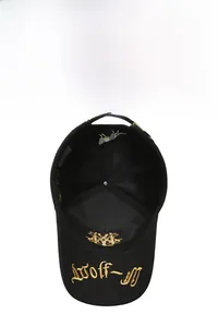 Close-up of gold embroidery on black cotton baseball cap with mesh ventilation detail