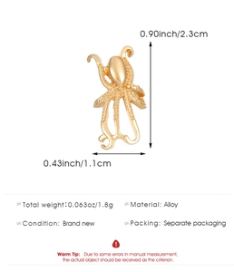 Detailed view of golden octopus ear cuff with measurements 2.3cm height and 1.1cm width
