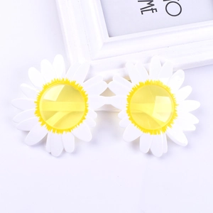 Close-up of funny white daisy flower sunglasses with yellow tinted lenses for party props