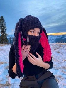 Detail of bunny ear balaclava with soft knit texture and pink contrast lining