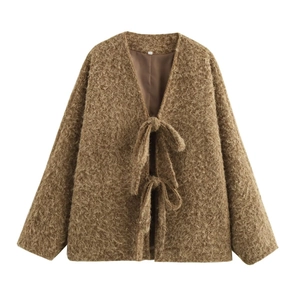 Detailed view of brown fuzzy textured jacket with double tie-up front and V-neckline