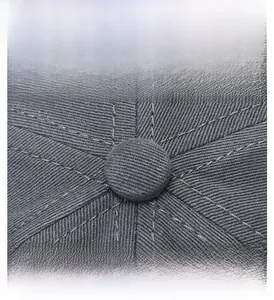 Detailed macro view of deep gray cotton twill baseball cap top and stitching
