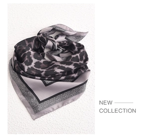 Macro view of grey leopard print faux silk square scarf with high quality fabric texture