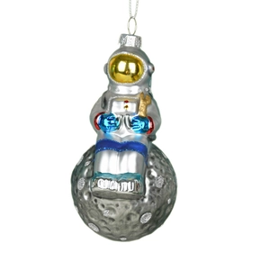 Astronaut sitting on glittery moon Christmas glass hanging ornament for festive tree decor