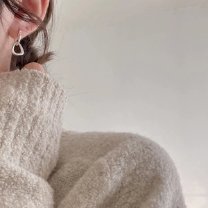 Minimalist S925 sterling silver hollow triangle hoop earrings on a female model