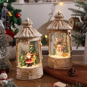 Cozy festive setting with Christmas snow globe lanterns featuring Santa and Snowman