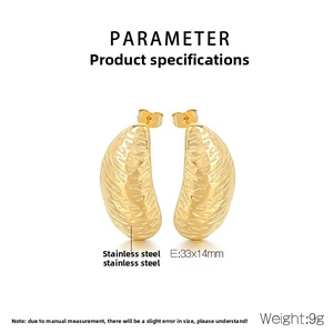 Detailed view of irregular hammered gold stainless steel earrings measuring 33x14mm